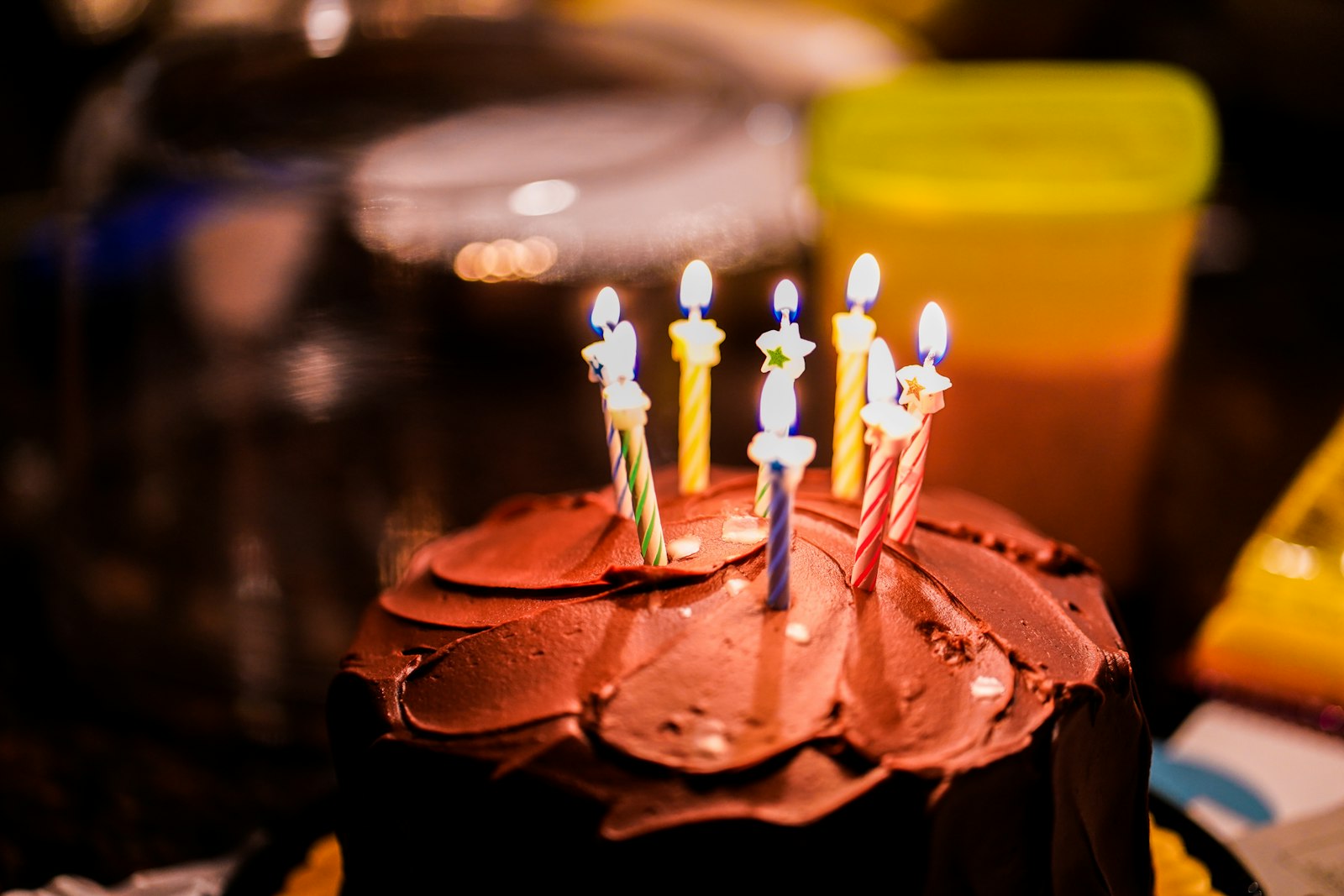 Birthday cake with glowing candles ready for a birthday countdown celebration